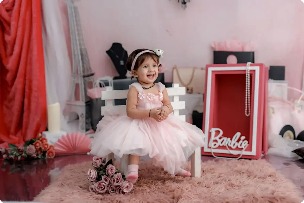 Girl wearing pink Barbie party outfit