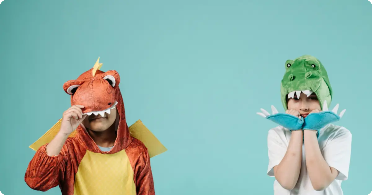Dinosaur birthday party with kids in dino costumes
