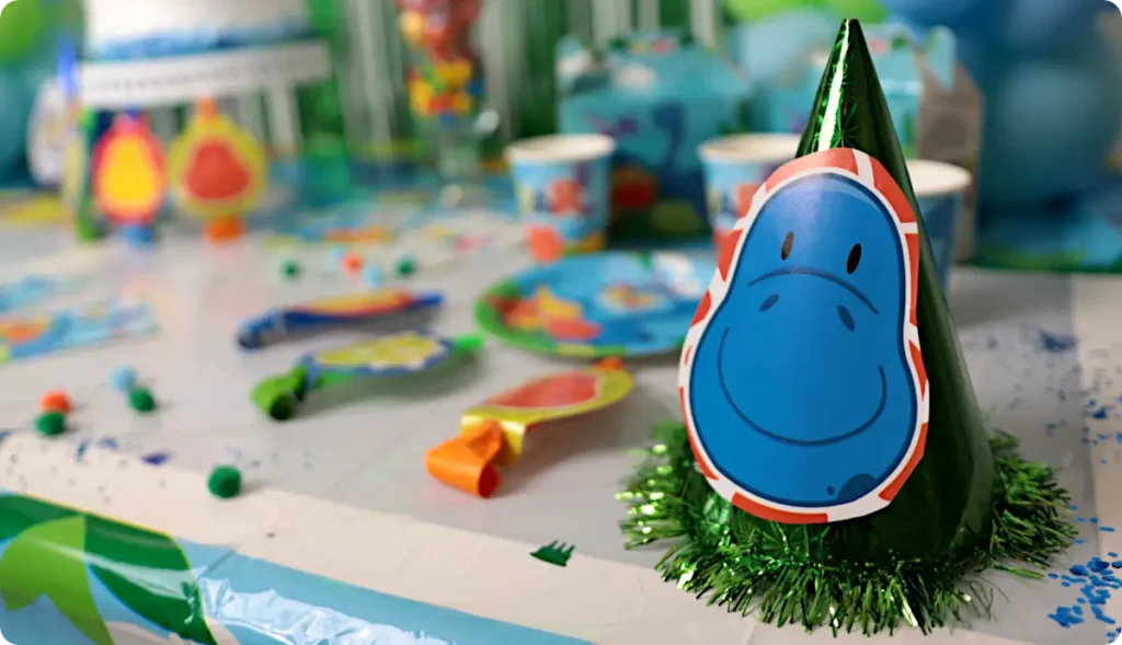 Dinosaur party hat on party table