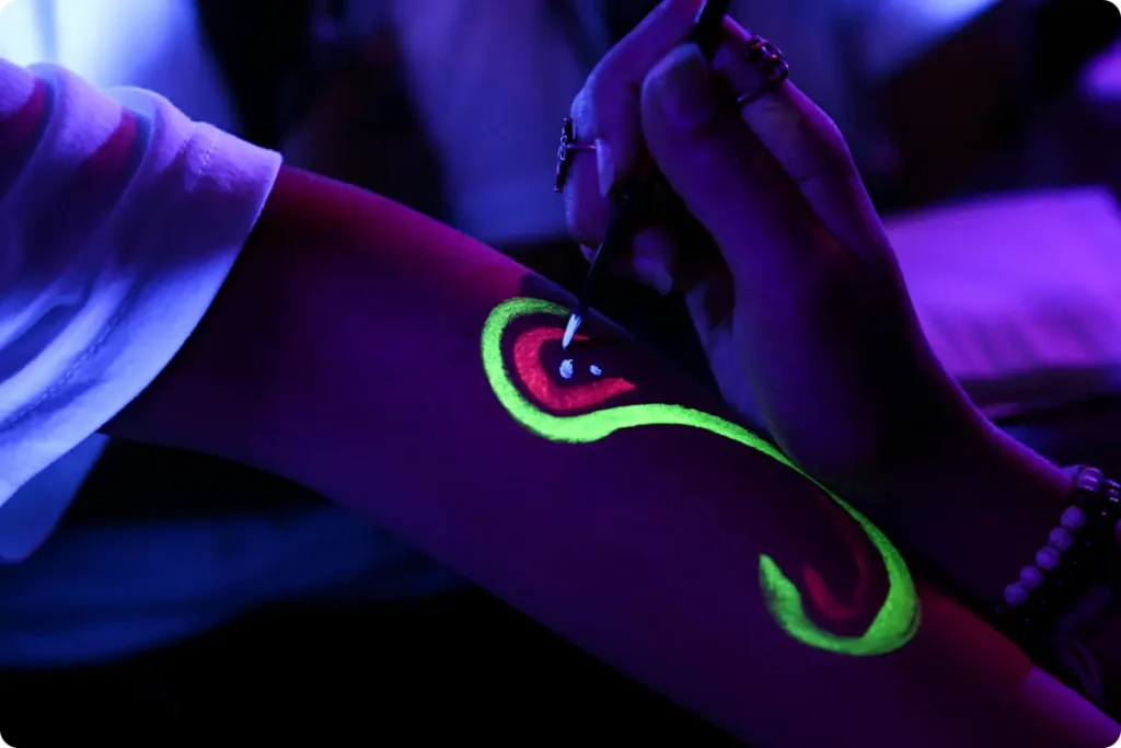 neon body paint on arm