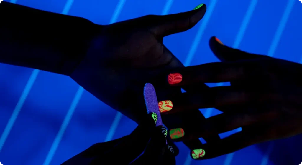 Glow in the dark fingernails at a neon party