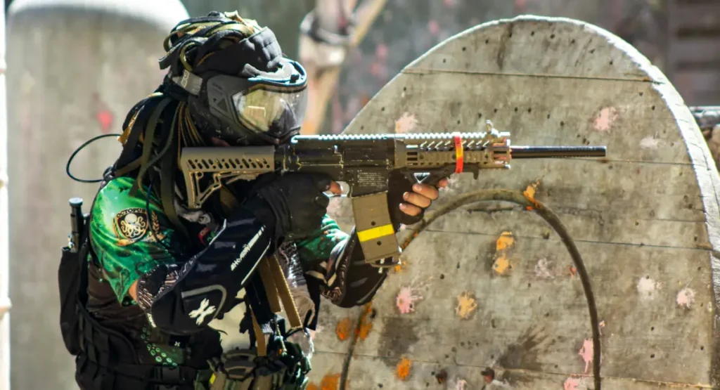 paintball party game player aiming with marker